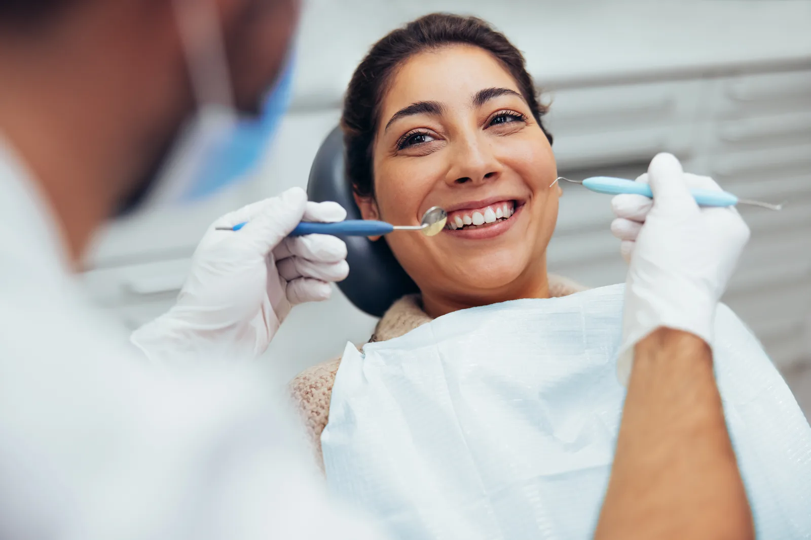 Adult patient receiving a specialist examination after a referral from their general dentist