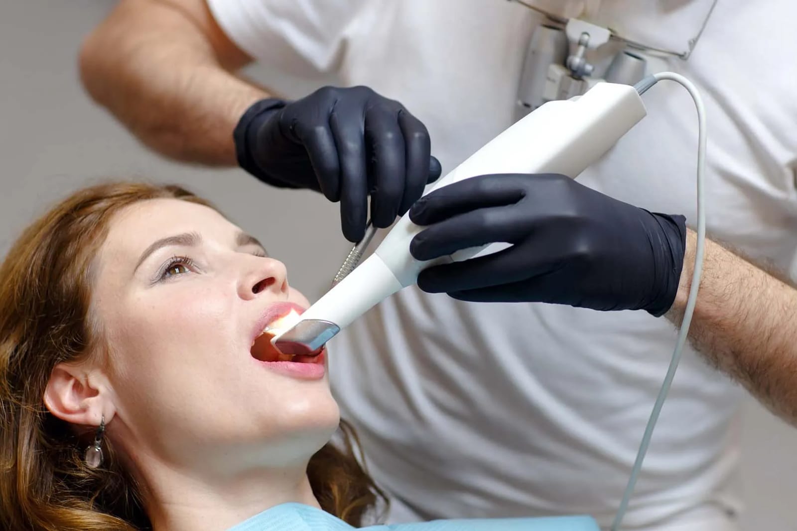 Patient receiving a digital intraoral scan with advanced imaging technology